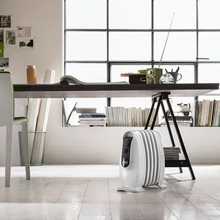 The De'Longhi TRNS0505M Oil Filled Radiator in an office with wood flooring
