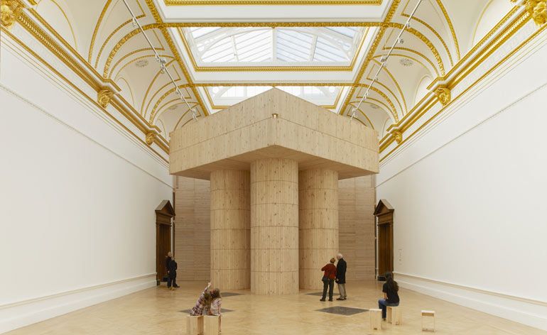 Large wooden structure in museum room