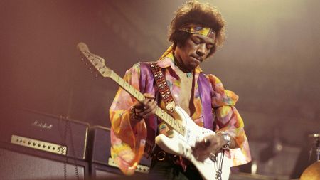 Jimi Hendrix (1942-1970) performs live on stage playing a white Fender Stratocaster guitar with The Jimi Hendrix Experience at the Royal Albert Hall in London on 24th February 1969