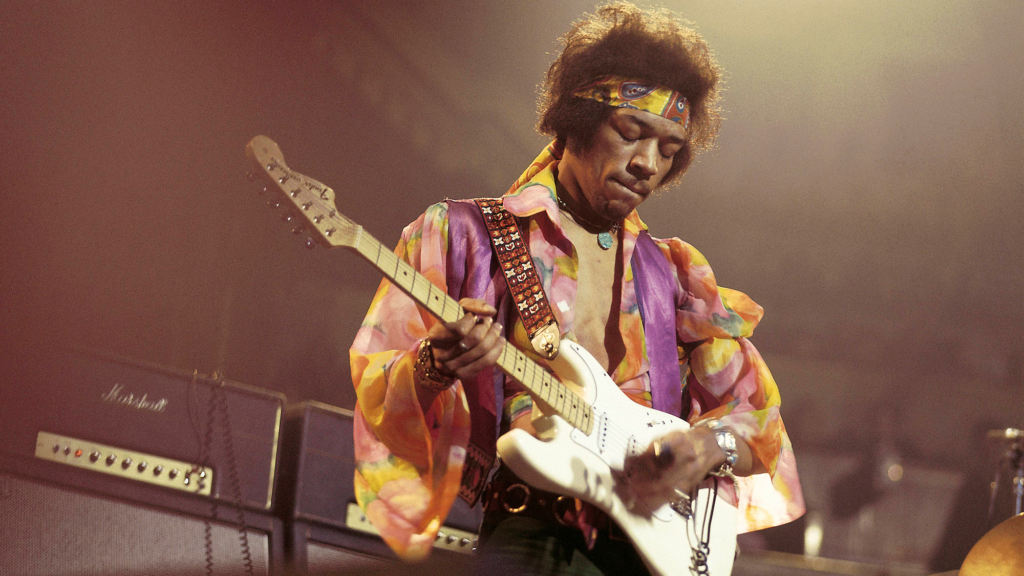 Jimi Hendrix (1942-1970) performs live on stage playing a white Fender Stratocaster guitar with The Jimi Hendrix Experience at the Royal Albert Hall in London on 24th February 1969