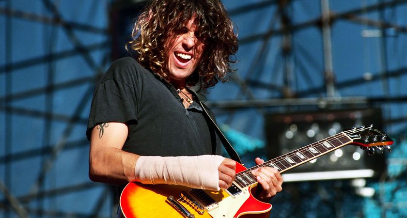 Dean DeLeo performs at the 1993 KROQ Weenie Roast with Stone Temple Pilots