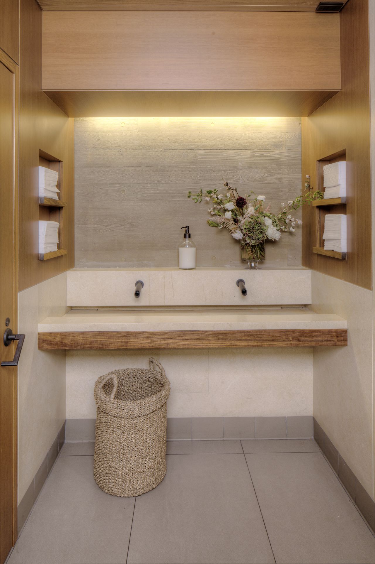 A bathroom with a faucet of unique shape