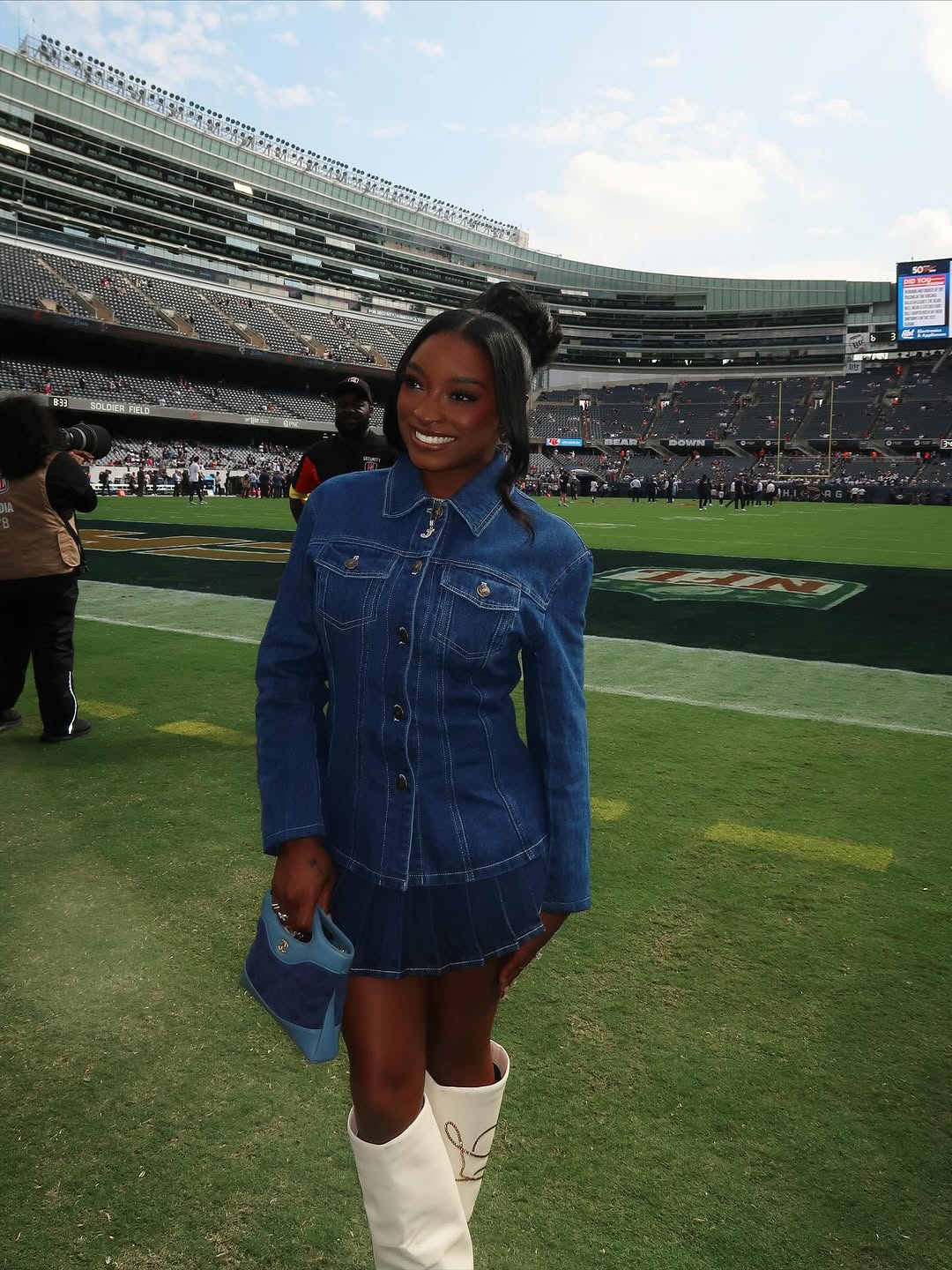 Simone Biles attended her husband&#039;s football game in the ultimate game day look: a denim skirt set, custom boots, and a Chanel bag