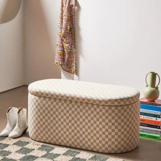 Shae Checkered Storage Bench in bedroom with checkered rug, cowboy boots and stack of books