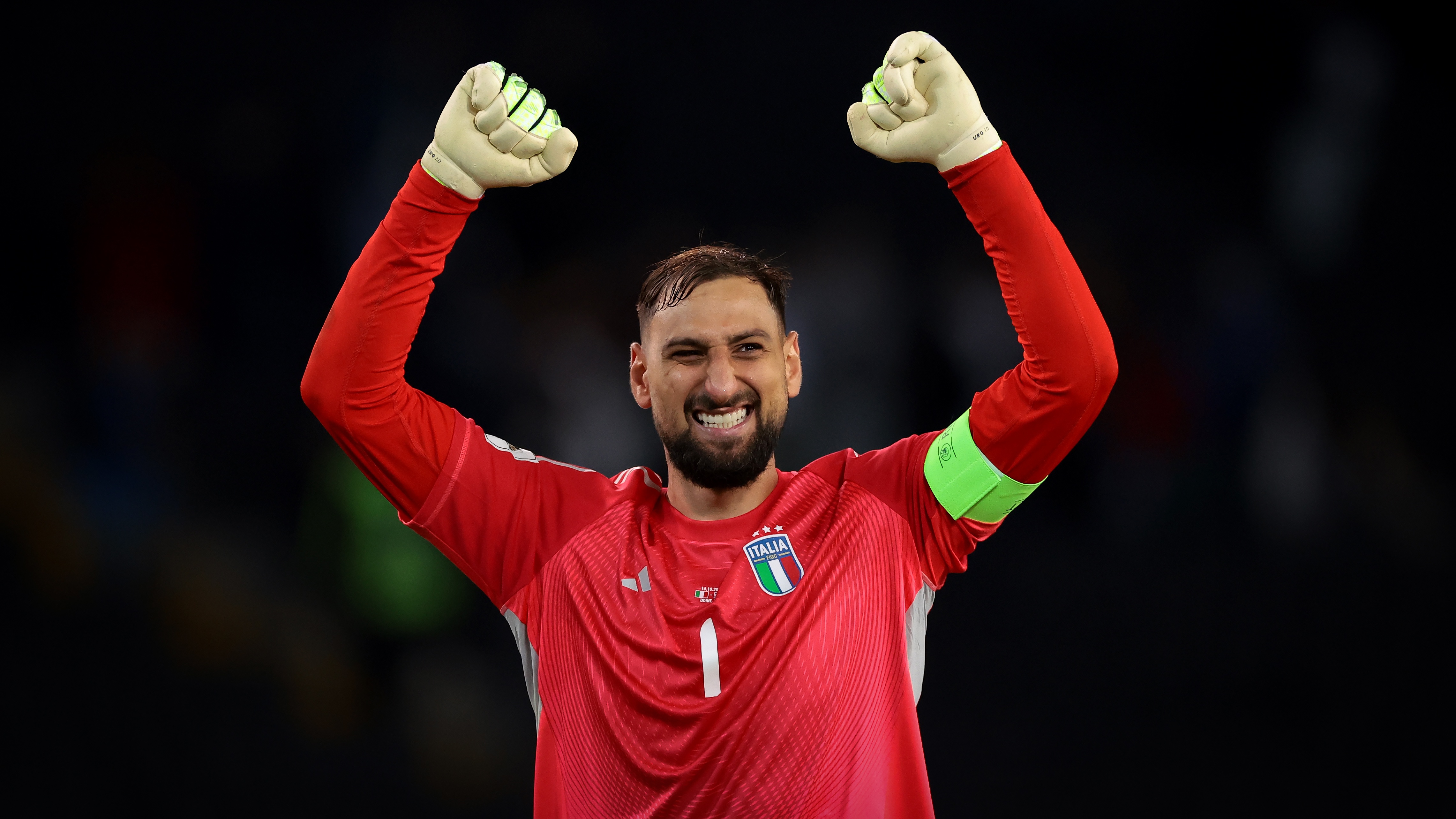 Gianluigi Donnarumma of Italy celebrates after a goal by teammate Gianluca Mancini during the FIFA World Cup 2026 qualifier match between Italy and Israel at Stadio Friuli on October 14, 2025 in Udine, Italy.