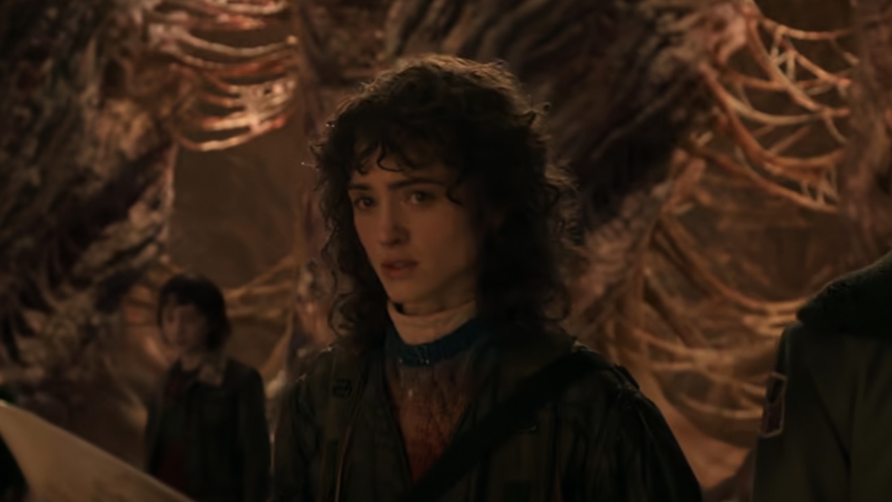 Natalie watching Joyce cut off Vecna's head.