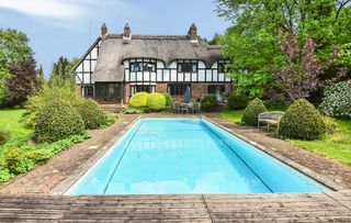 Plum Trees in Berkshire is a lovely example of a house with a swimming pool that fits beautifully into the surroundings.