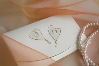 envelope with embossed gold hearts