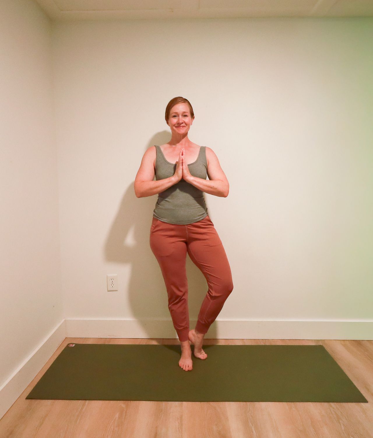 Woman demonstrates yoga pose
