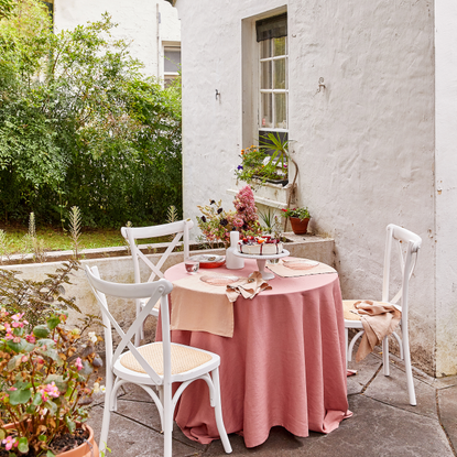 Bedthreads tableware on white bistro table in garden