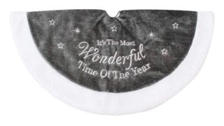 A grey and white christmas tree skirt that reads "It's the most wonderful time of the year".