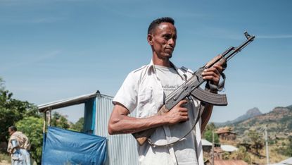 A member of the Tigray People’s Liberation Front holding an assault rifle.