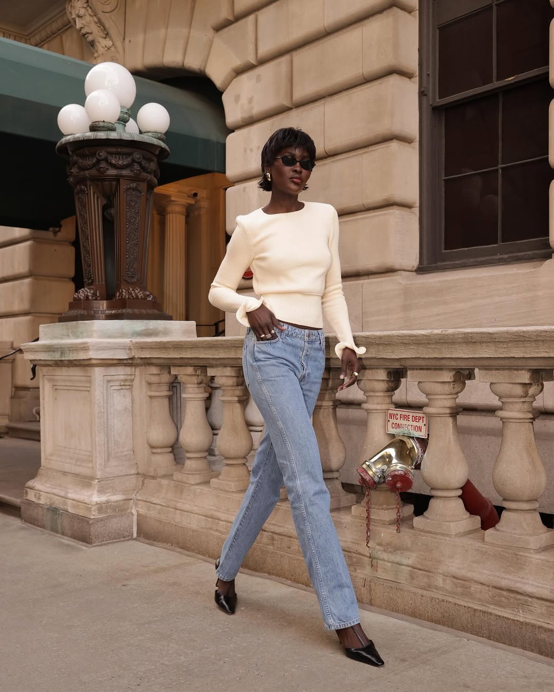 woman wearing black pointed toe heels jeans fall outfits 2025