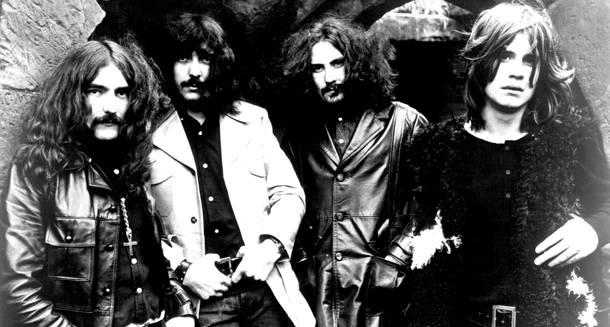A black-and-white portrait of Black Sabbath in 1970 [L-R]: Geezer Butler, Tony Iommi, Bill Ward, Ozzy Osbourne.