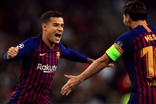 Philippe Coutinho, left, celebrates with Lionel Messi after scoring for Barcelona