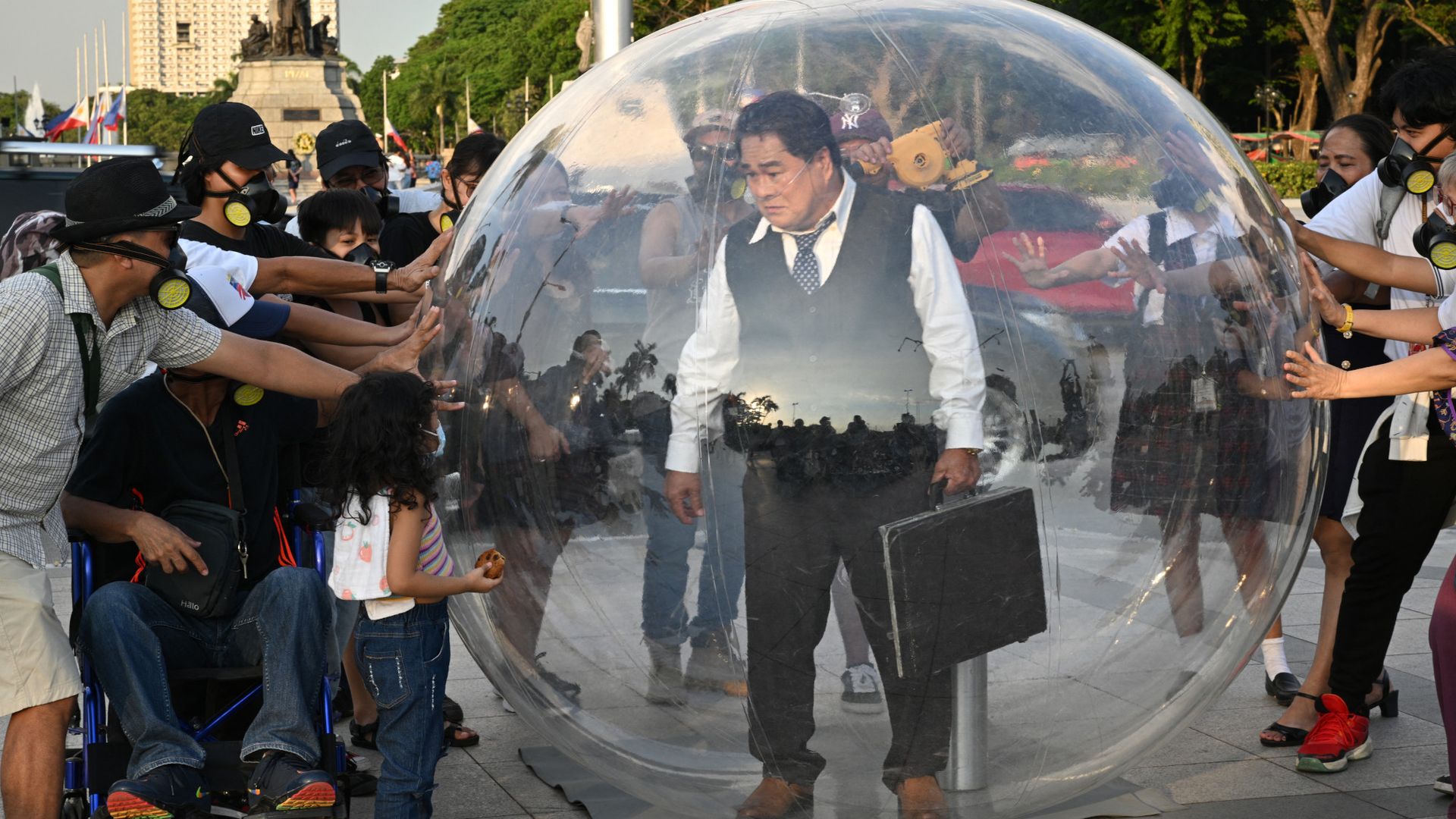 
                                Philippine actor Soliman Cruz stands inside of a bubble during an anti-pollution protest in Manila, Philippines
                            