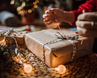 Woman wrapping Christmas gifts