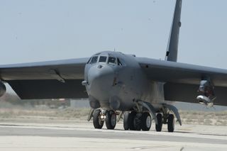 A B-52H Stratofortress taxis to the runway at Edwards Air Force Base, Calif.. carrying the X-51A Waverider scramjet in 2011.