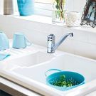 ceramic sink with teacup and photo frame