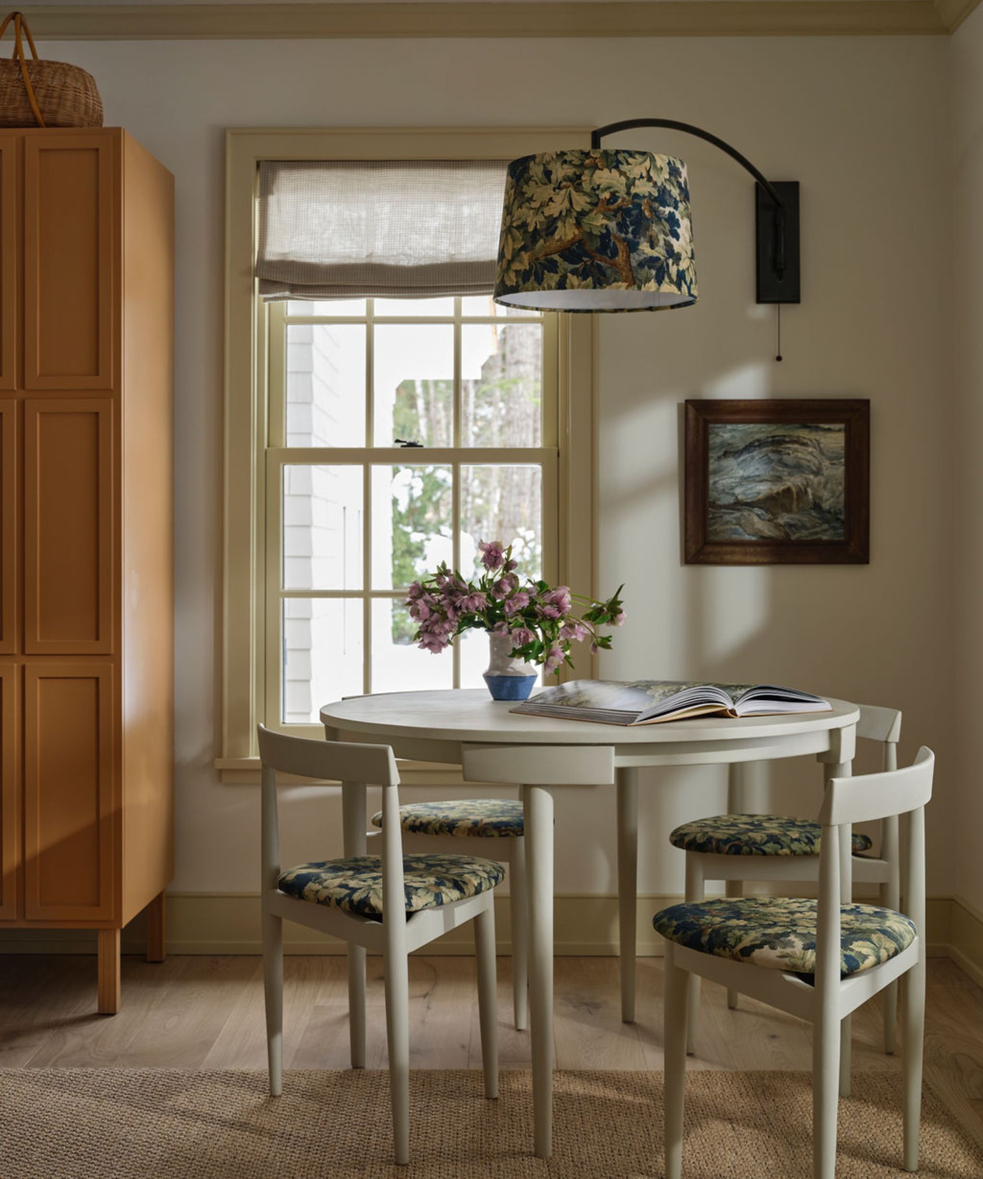 A cozy dining nook in an open plan living and dining space