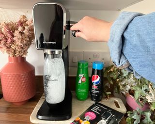 A SodaStream on a counter.