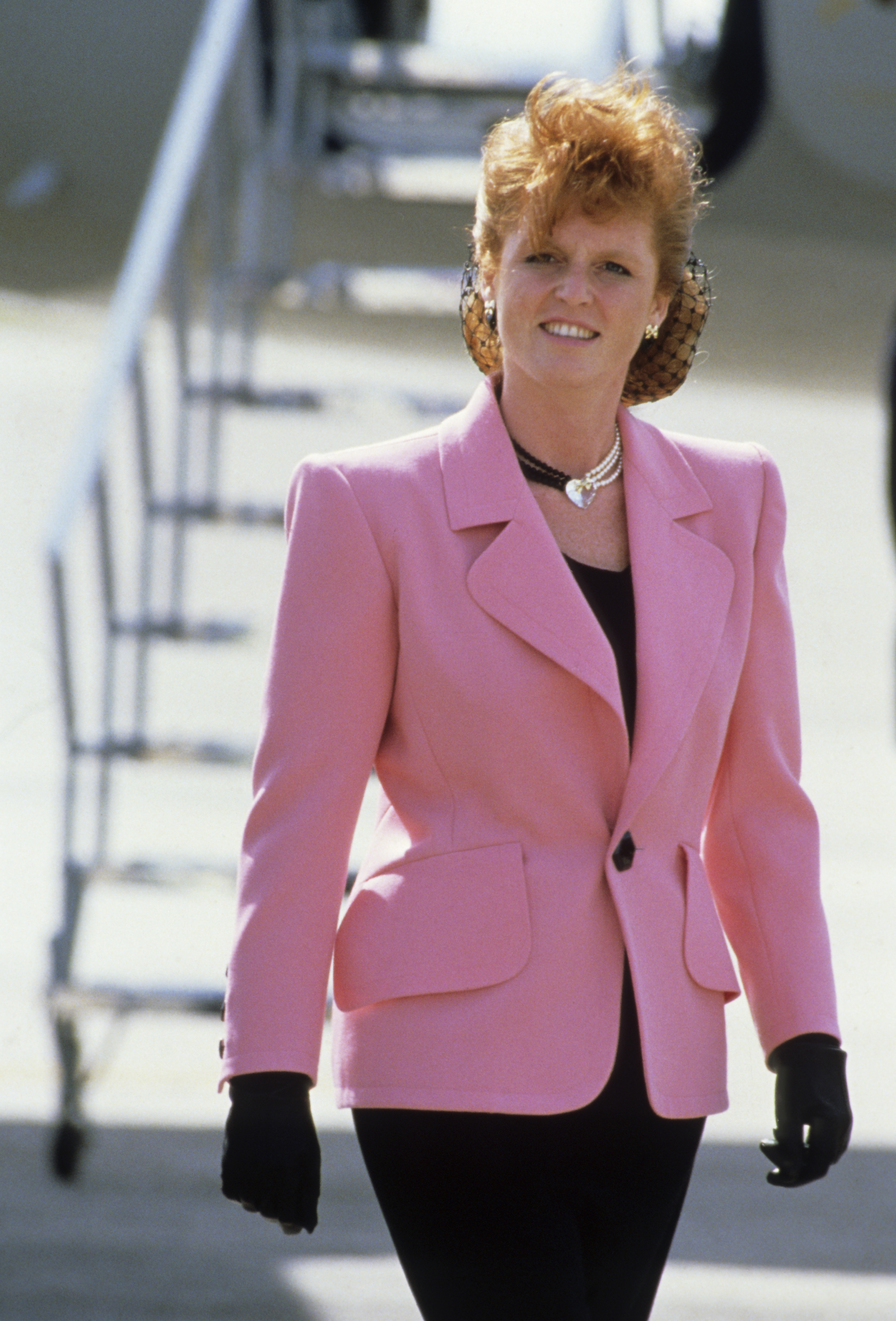 Sarah Ferguson wearing a pink blazer and a choker necklace
