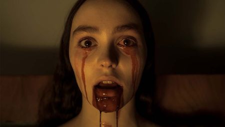 Close-up of Ellen Hutter (Lily-Rose Depp) with blood pouring from her eyes and mouth as she stares directly into the camera 