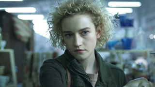 Julia Garner illuminated by flourescent lights in Weapons