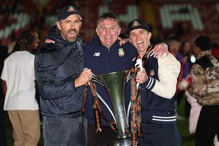 Ryan Reynolds, Phil Parkinson and Rob McElhenney at Wrexham after winning promotion to League Two
