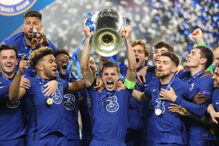 Chelsea players celebrate with the Champions League trophy after victory over Manchester City in the 2021 final in Porto.