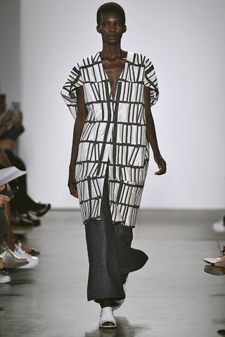 Model wearing black and white dress