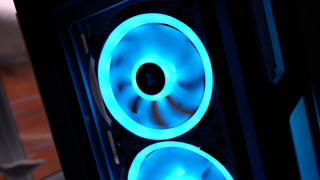 Corsair iCUE 5000T RGB mid-tower PC case with RGB lighting enabled in blue and pink