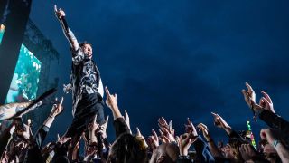 A photo of Frank Carter on stage at Download