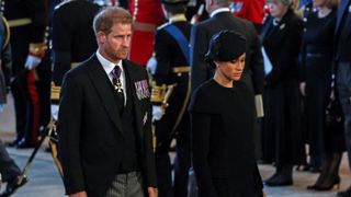 Britain's Prince Harry, Duke of Sussex and Meghan, Duchess of Sussex attend a service for the reception of Queen Elizabeth II's coffin at Westminster Hall, in the Palace of Westminster in London on September 14, 2022,