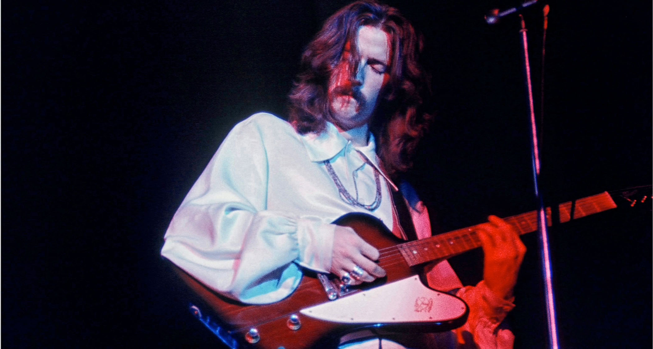 Eric Clapton plays a Gibson Firebird onstage with Cream