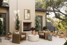 flower container trends: terrace patio with terracotta flower pots and outdoor living room by Ryan Street
