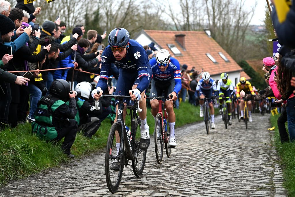 OUDENAARDE BELGIUM APRIL 02 LR Stefan Kng of Switzerland and Team GroupamaFDJ and Mathieu Van Der Poel of The Netherlands and Team AlpecinDeceuninck compete passing through a Molenberg cobblestones sector during the 107th Ronde van Vlaanderen Tour des Flandres 2023 Mens Elite a 2734km one day race from Brugge to Oudenaarde UCIWT on April 02 2023 in Brugge Belgium Photo by Tim de WaeleGetty Images