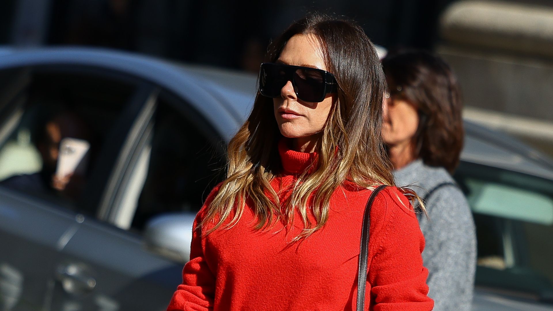 Victoria Beckham always looks chic, but a pillar box red roll neck and camel flared trousers has to be one of her best ever combinations