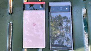 pixel 6 and pixel 6 pro on a bench