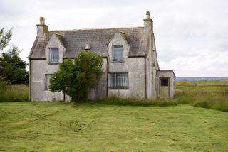 Derelict house with subsidence