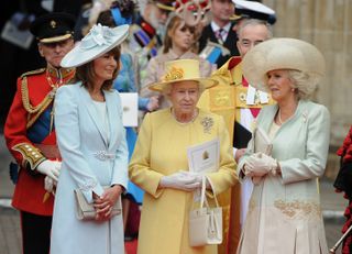 Queen Elizabeth II (C), Carole Middleton (L) and Camilla, Duchess of Cornwall come out of Westminster Abbey in London, following the wedding ceremony of Prince William and Kate, Duchess of Cambridge.