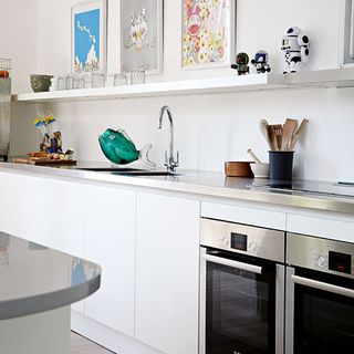 kitchen with hidden storage and neutral backdrop of white and grey
