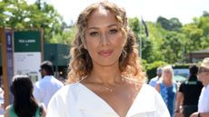 Leona Lewis, wearing a white dress, attends day eleven of the Wimbledon Tennis Championships at the All England Lawn Tennis and Croquet Club on July 10, 2025
