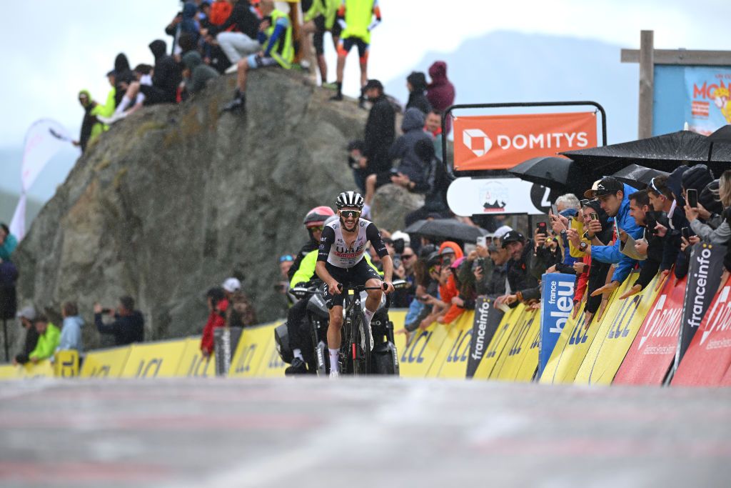 COL DE LA CROIX DE FER FRANCE JUNE 10 Adam Yates of The United Kingdom and UAE Team Emirates crosses the finish line during the 75th Criterium du Dauphine 2023 Stage 7 a 1479km stage from PortedeSavoie to Col de la Croix de Fer 2067m UCIWT on June 10 2023 in Col de la Croix de Fer France Photo by Dario BelingheriGetty Images