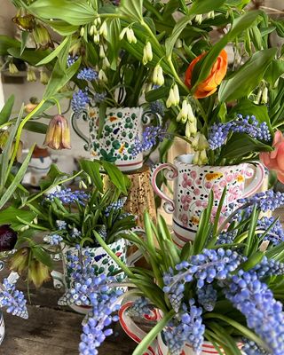 Colourful mug-shaped vases