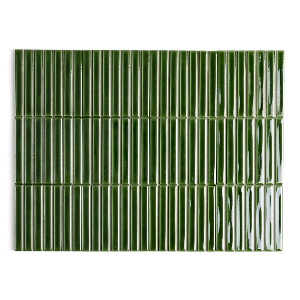 A close-up of glossy forest green ridged ceramic tiles arranged in a vertical brick pattern with a ribbed surface texture.