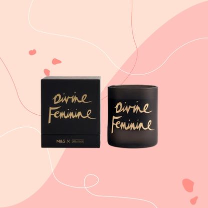 A Bella Freud x M&S candle with 'Divine Feminine' slogan on pink graphic background