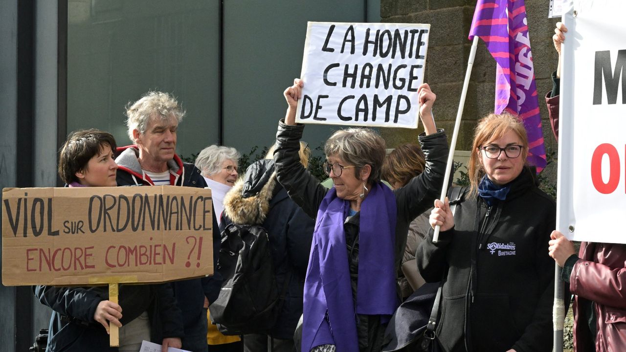 Protesters outside the criminal court in Vannes, France, on the opening day of Joel Le Scouarnec&#039;s four-month trial 