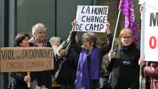 Protesters outside the criminal court in Vannes, France, on the opening day of Joel Le Scouarnec's four-month trial 