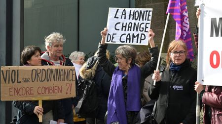 Protesters outside the criminal court in Vannes, France, on the opening day of Joel Le Scouarnec's four-month trial 